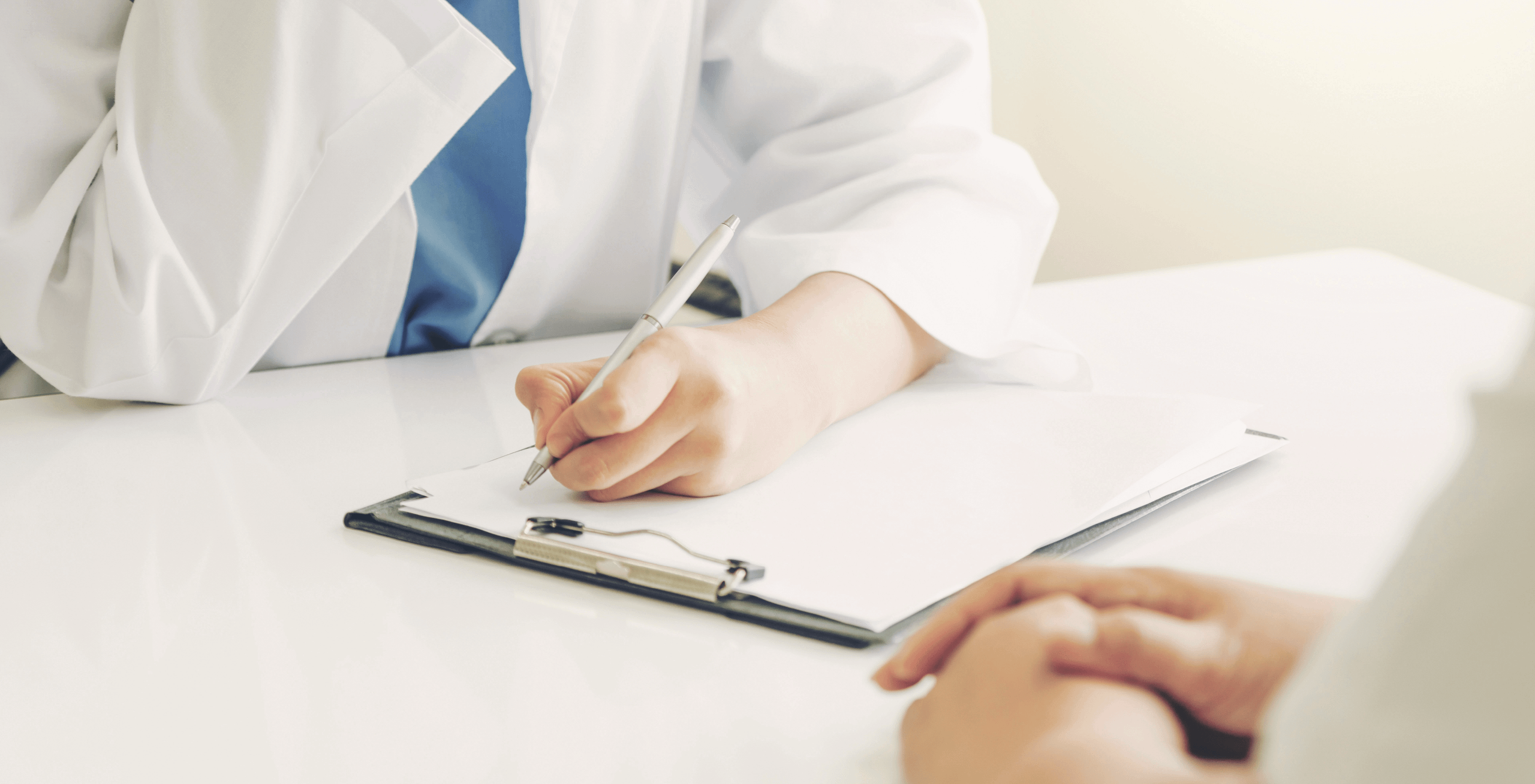 A doctor writing a prescription