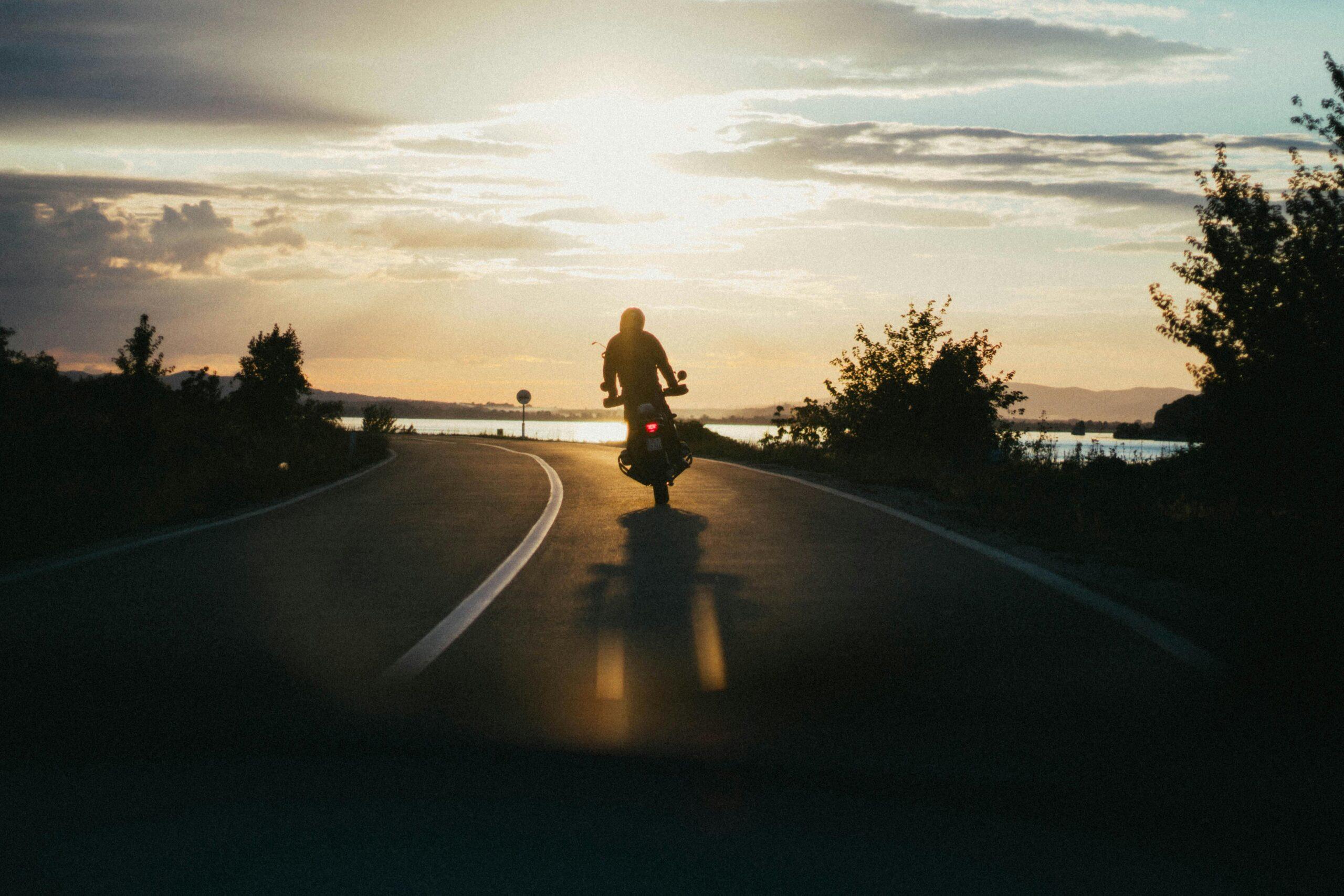 motorcyclist at sunset