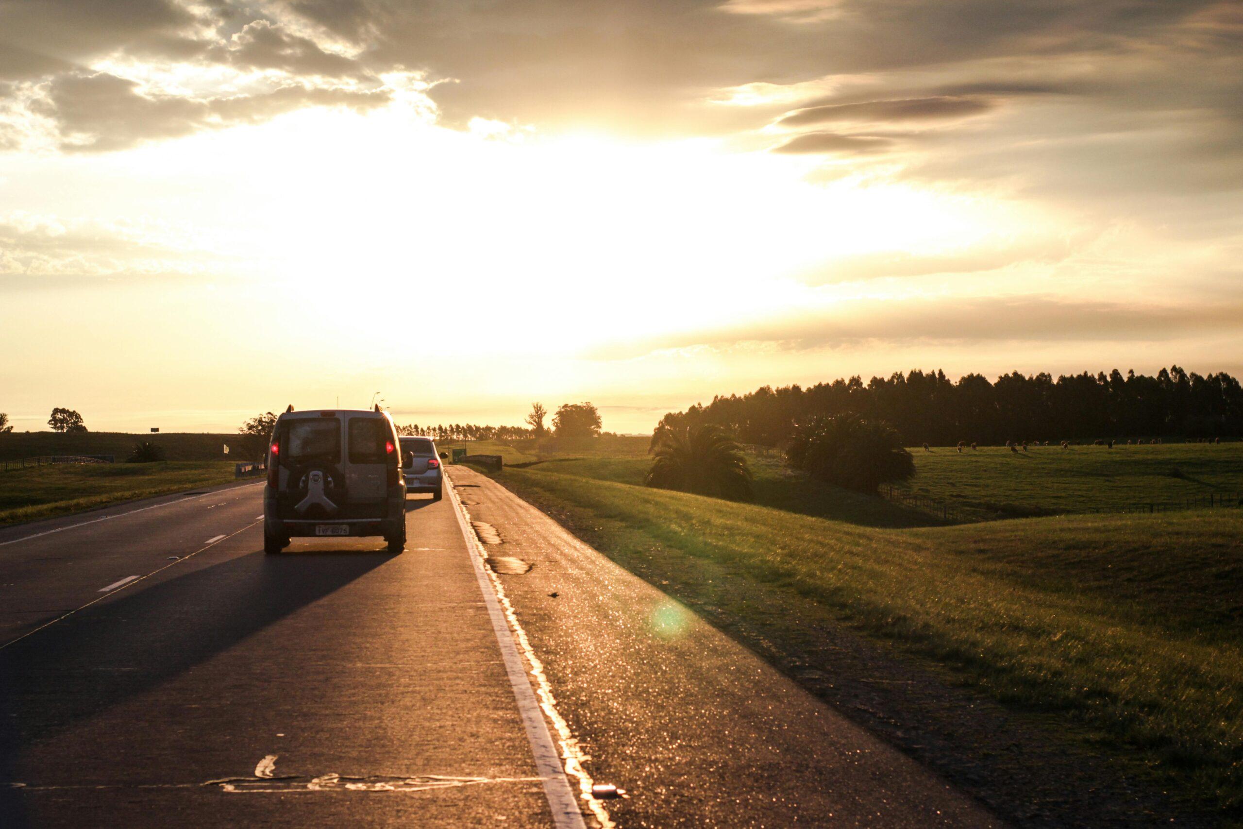 cars driving at sunset