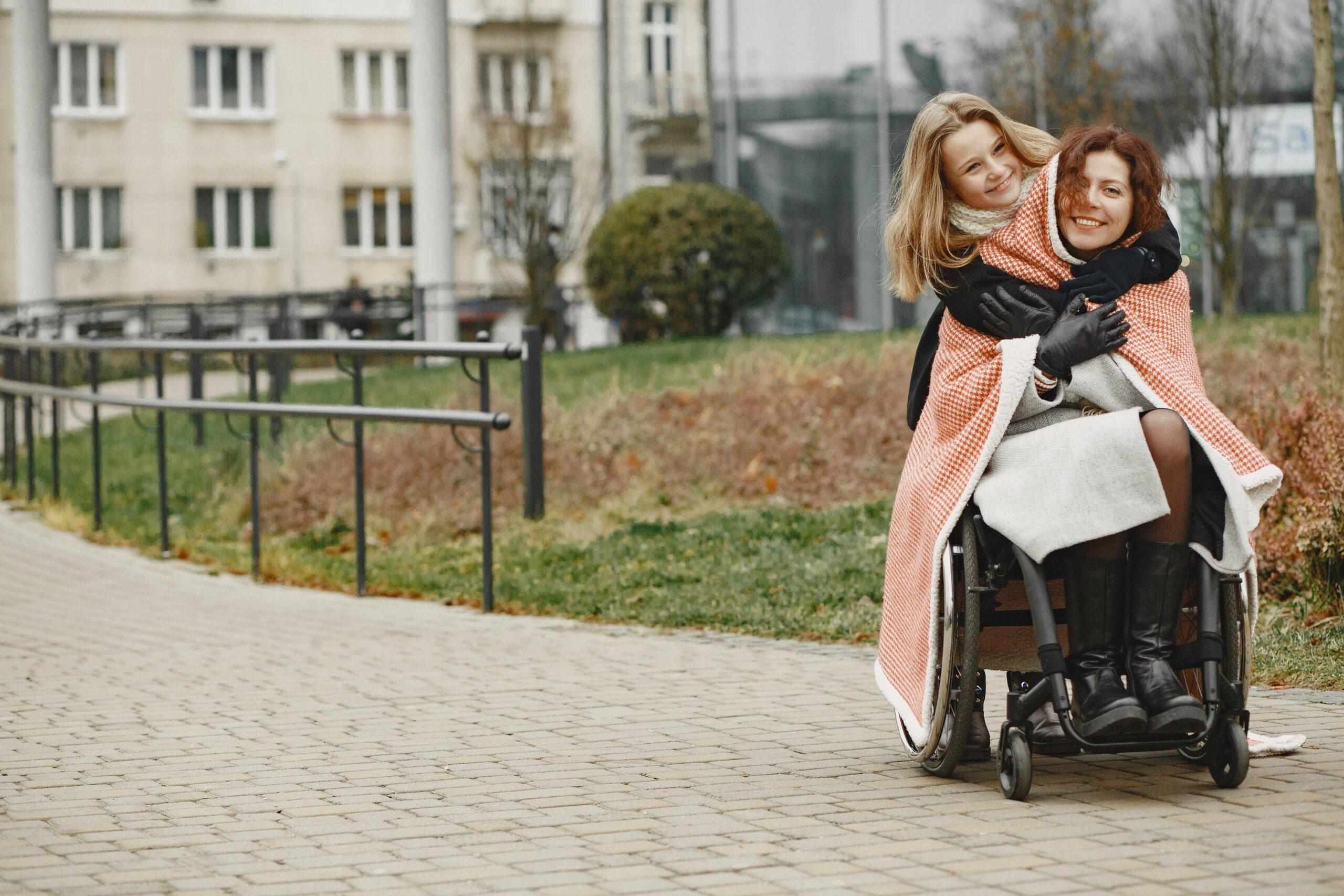 woman hugging disabled friend
