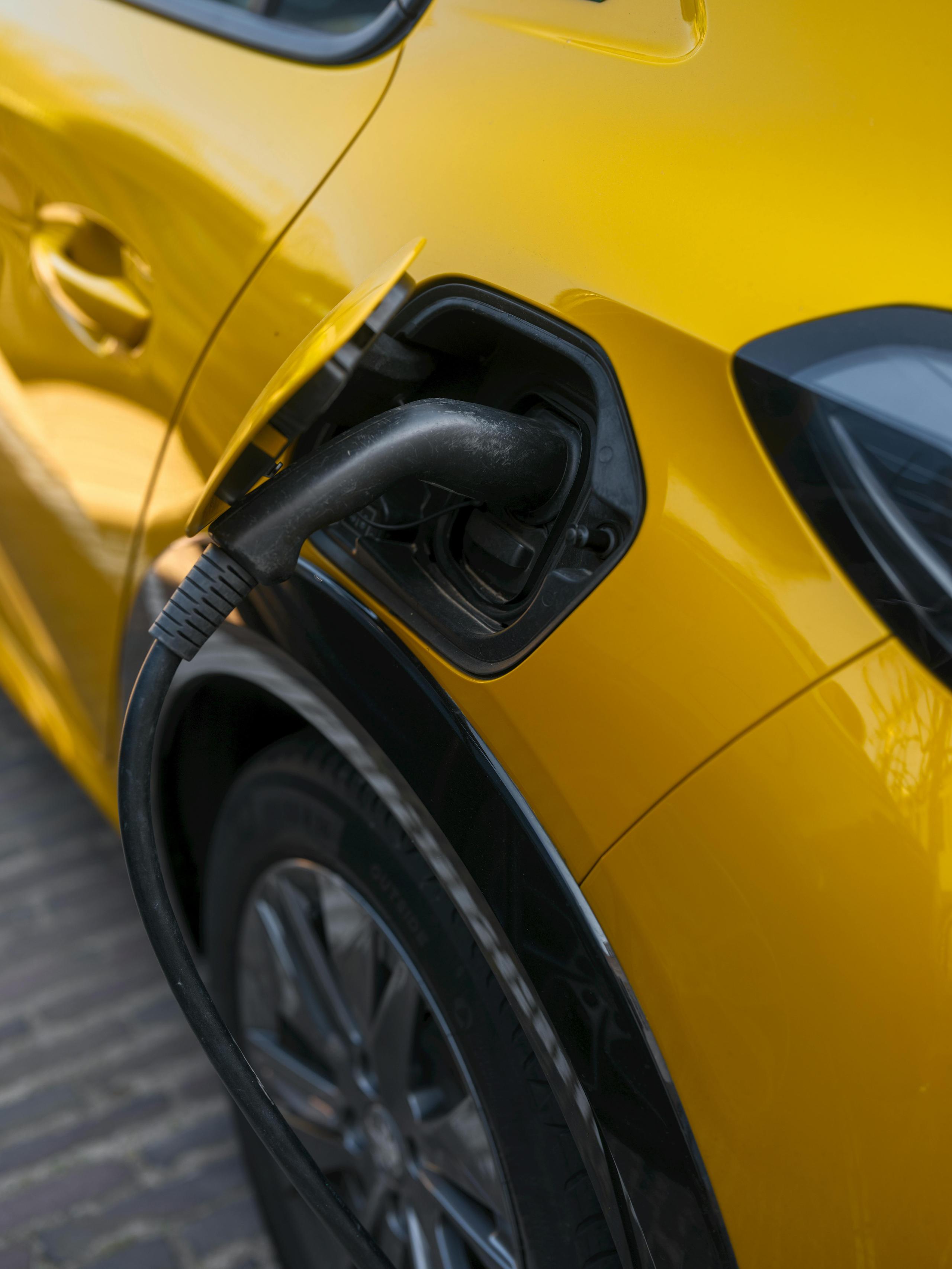 yellow car getting gas