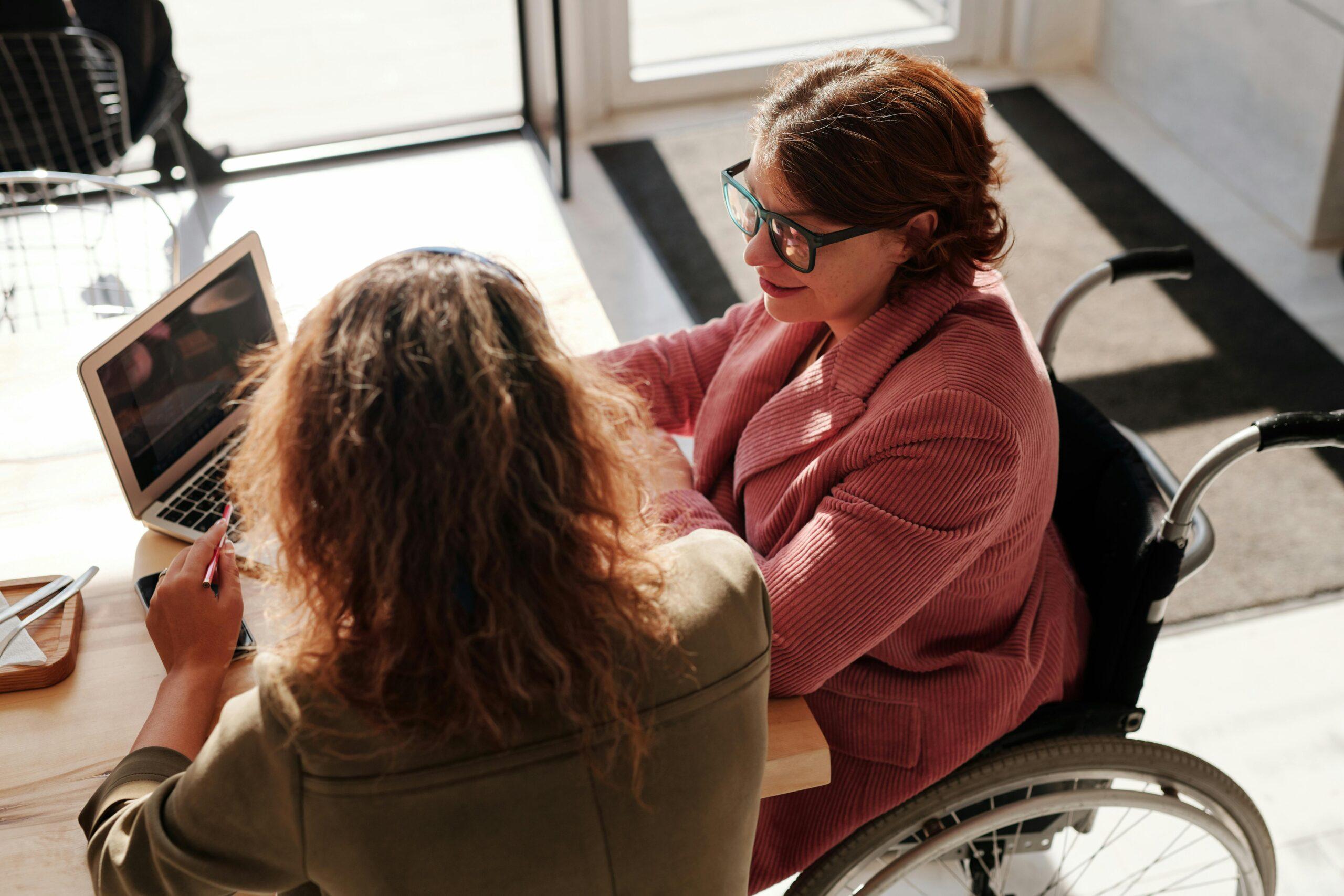 woman in wheelchair working