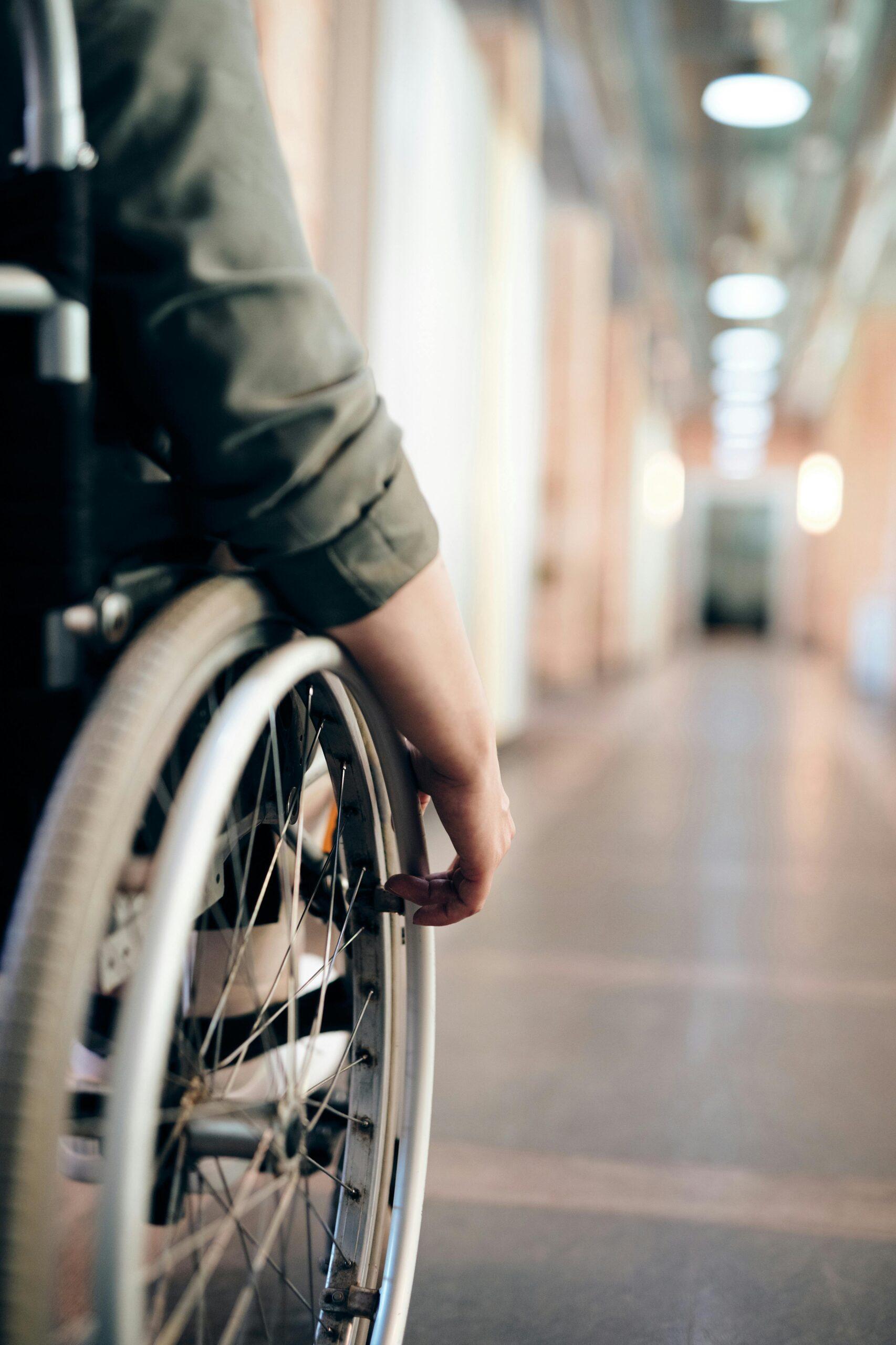 person holding wheelchair