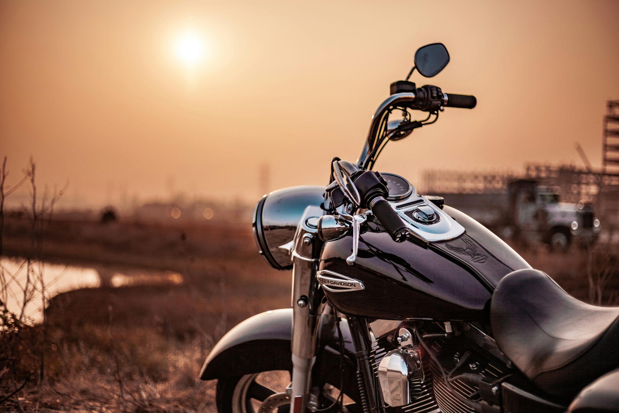 front of motorcycle at sunrise