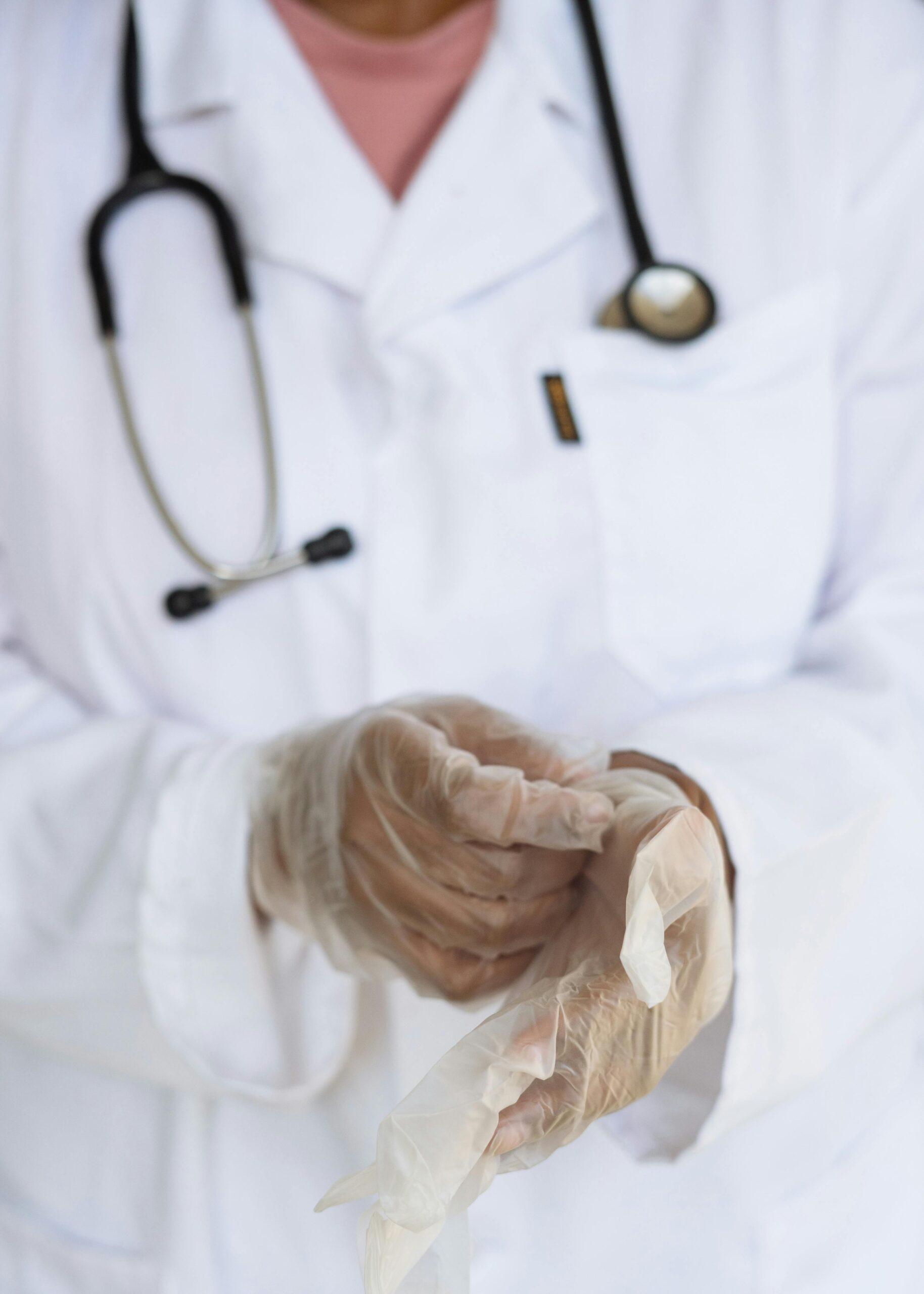doctor adjusting glove
