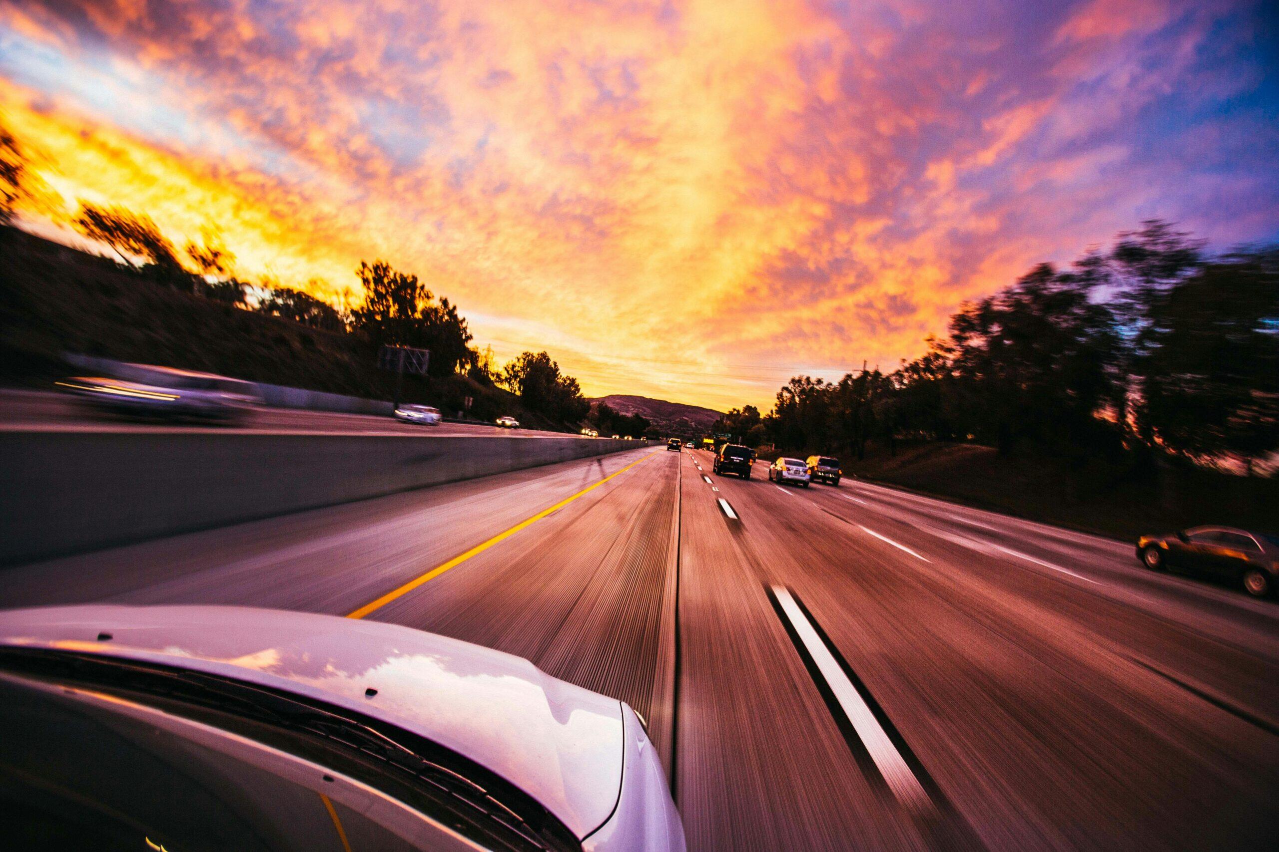 car driving at sunset