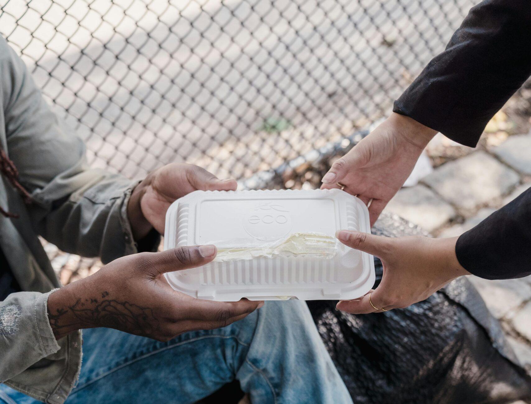 Homeless person accepting food